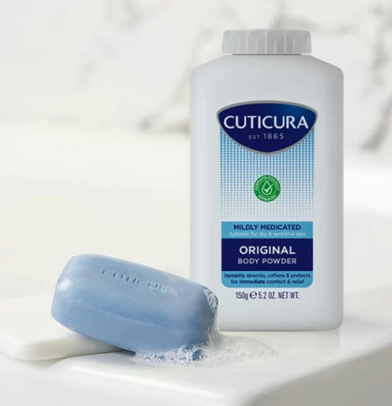 Cuticura Mildly Medicated Original Body Powder next to bar of soap